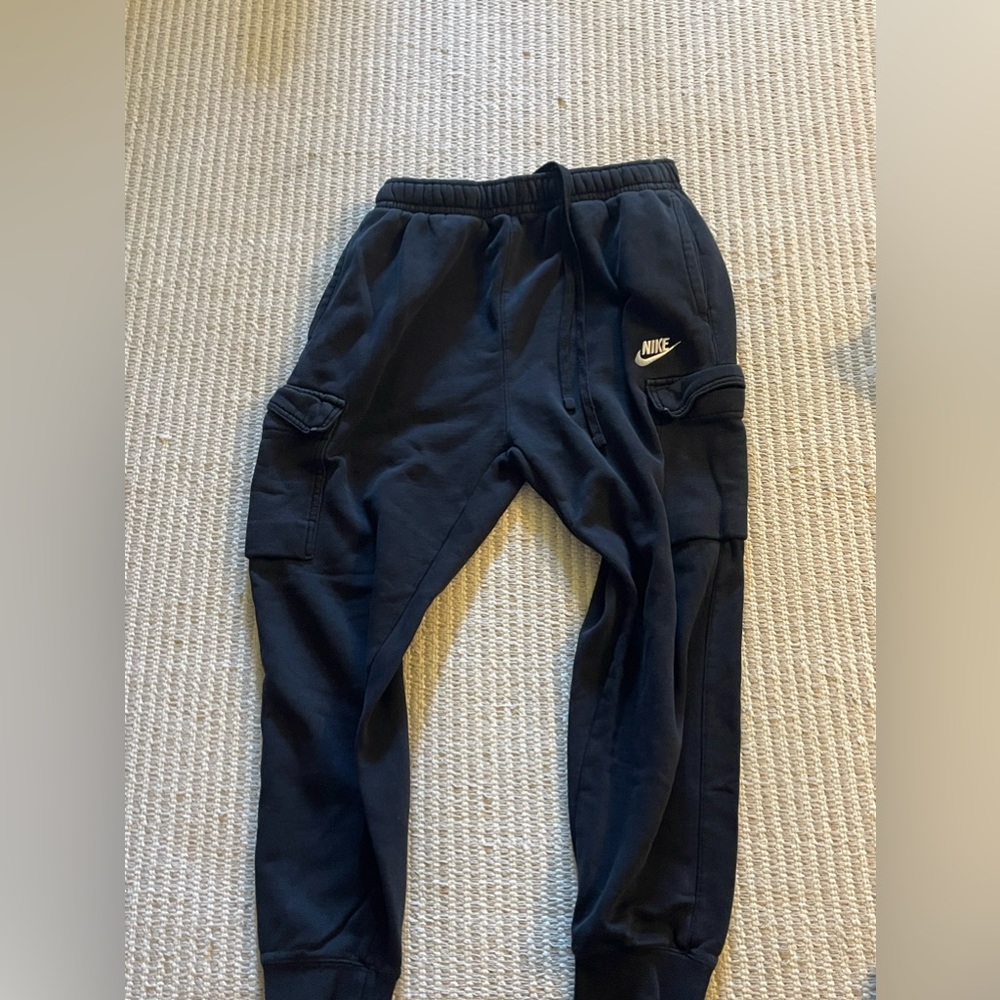 2 pairs of nike sweat pants, 1 cuffed, 1 flared